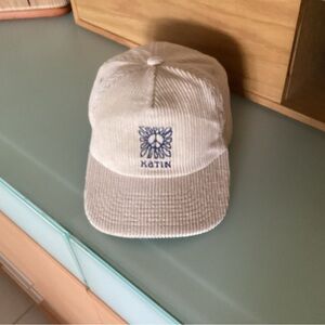 Cream corduroy baseball hat by Katin with embroidered peace sign.
